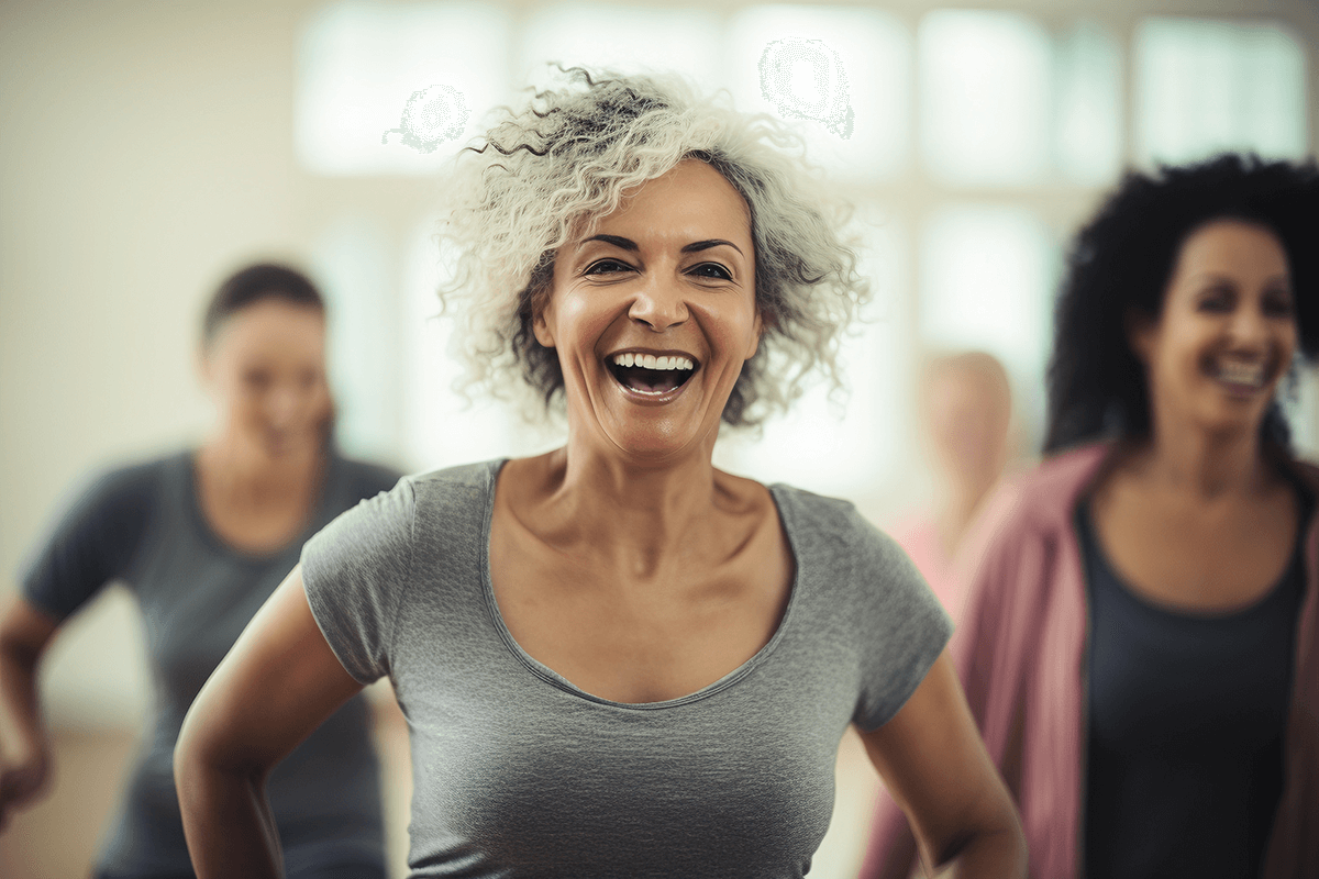 woman in vibrant health enjoying an exercise class